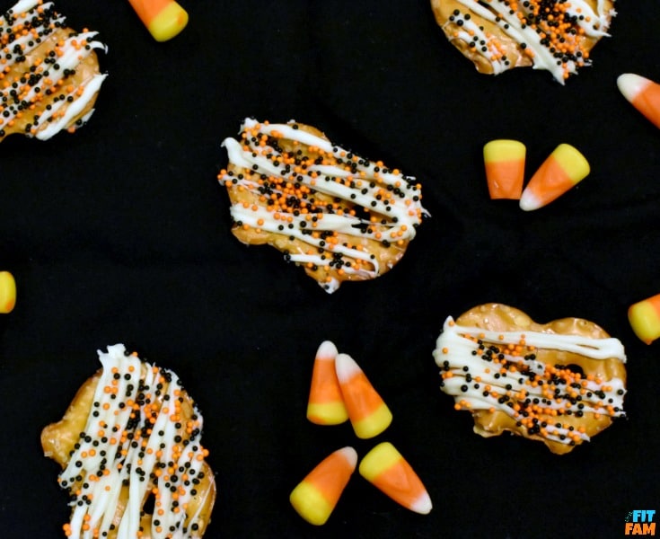how to make yogurt covered pretzels that are perfect for Halloween party food! They are so easy, yummy, and a great healthy snack! My favorite guilt free Halloween treat!