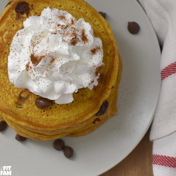 super easy homemade pumpkin pancakes, perfect fall recipe for breakfast, halloween, thanksgiving, or just because you're craving pumpkin chocolate chip pancakes