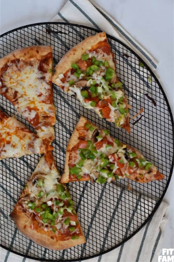 homemade pizza slices some just pepperoni and some loaded with veggies.