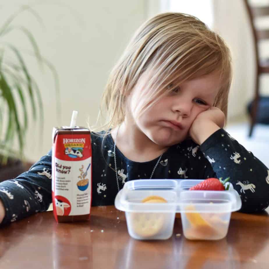 picture of my daughter unwilling to eat her lunch.