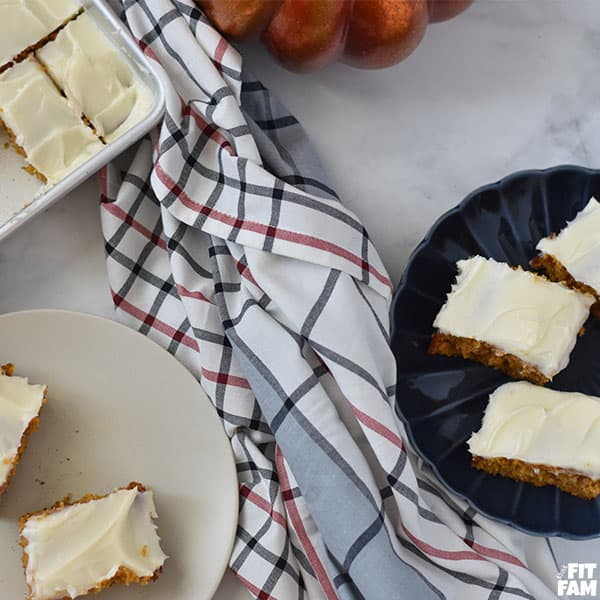 a bunch of pumpkin bars served onto plates