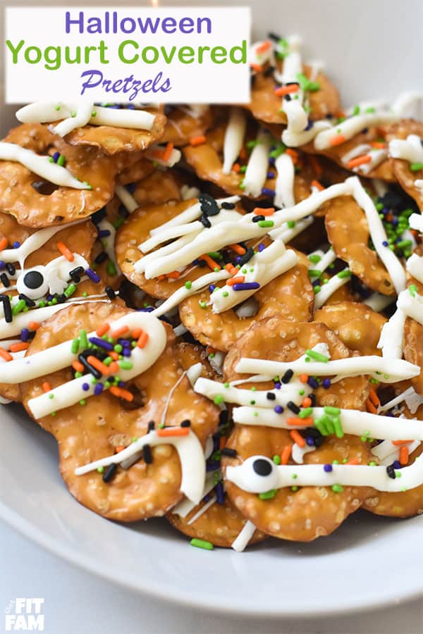 easy Halloween yogurt covered pretzels are the perfect simple snack to bring to your next Halloween party! they're even great to eat with popcorn on a scary movie night