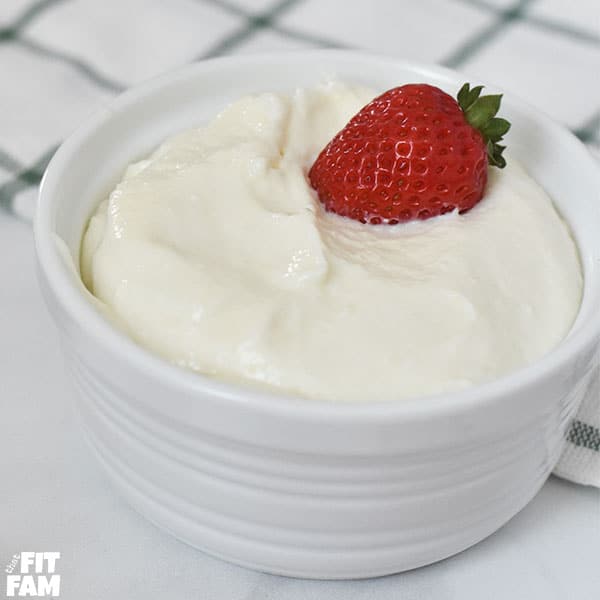 healthy fruit dip in a bowl with a strawberry