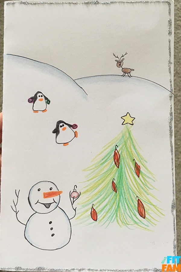 animals and snowman decorating Christmas tree in snow