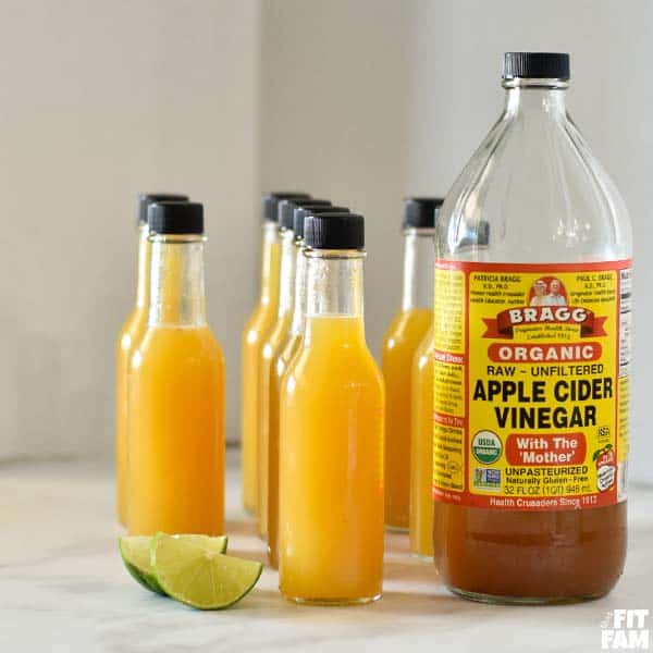 bragg organic acv with bottles of pineapple drink