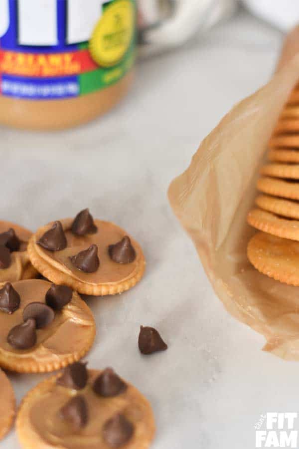 Several RITZ crackers with peanut butter and chocolate chips