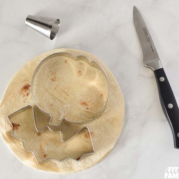 flour tortilla with Halloween cookie cutters