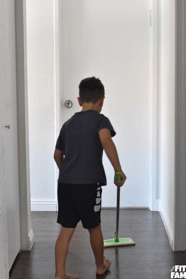 5 year old mopping the floor