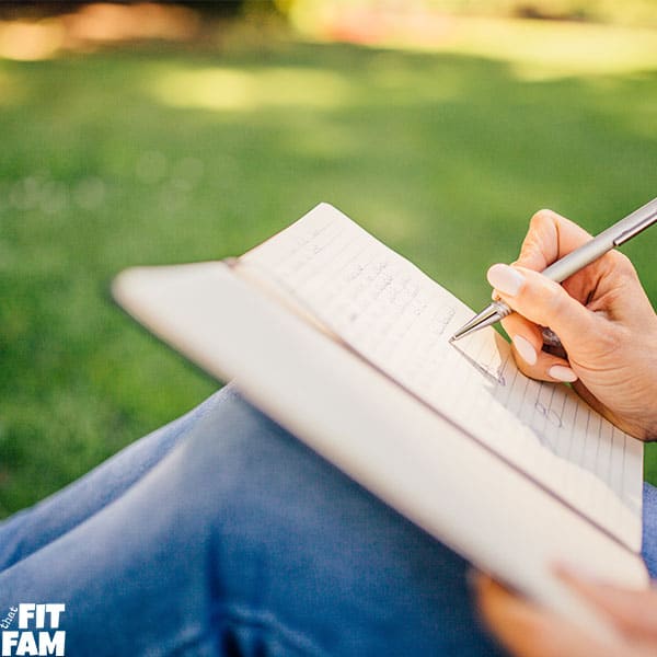 woman journaling at the park