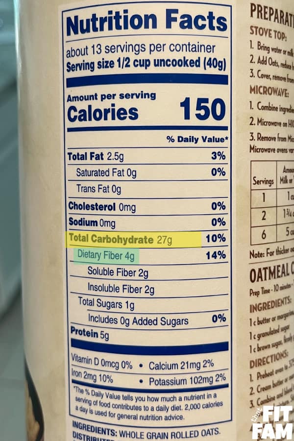 nutrition label of a container of rolled oats with carbs and fiber info highlighted