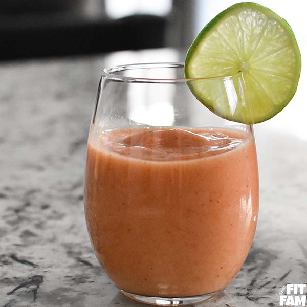 strawberry mango lime smoothie with lime garnish