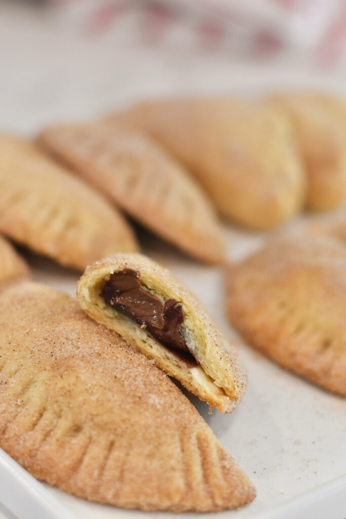 delicious sweet empanada filled with Nutella and coated in cinnamon sugar